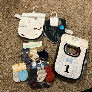 Baby bibs, socks, and mittens